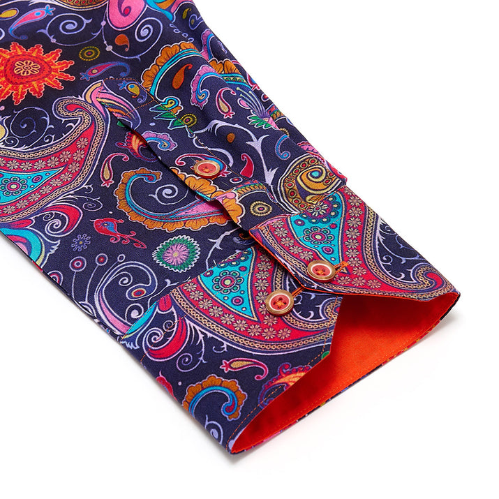 Colorful paisley-patterned shirt with a orange contrast  cuff on a white background